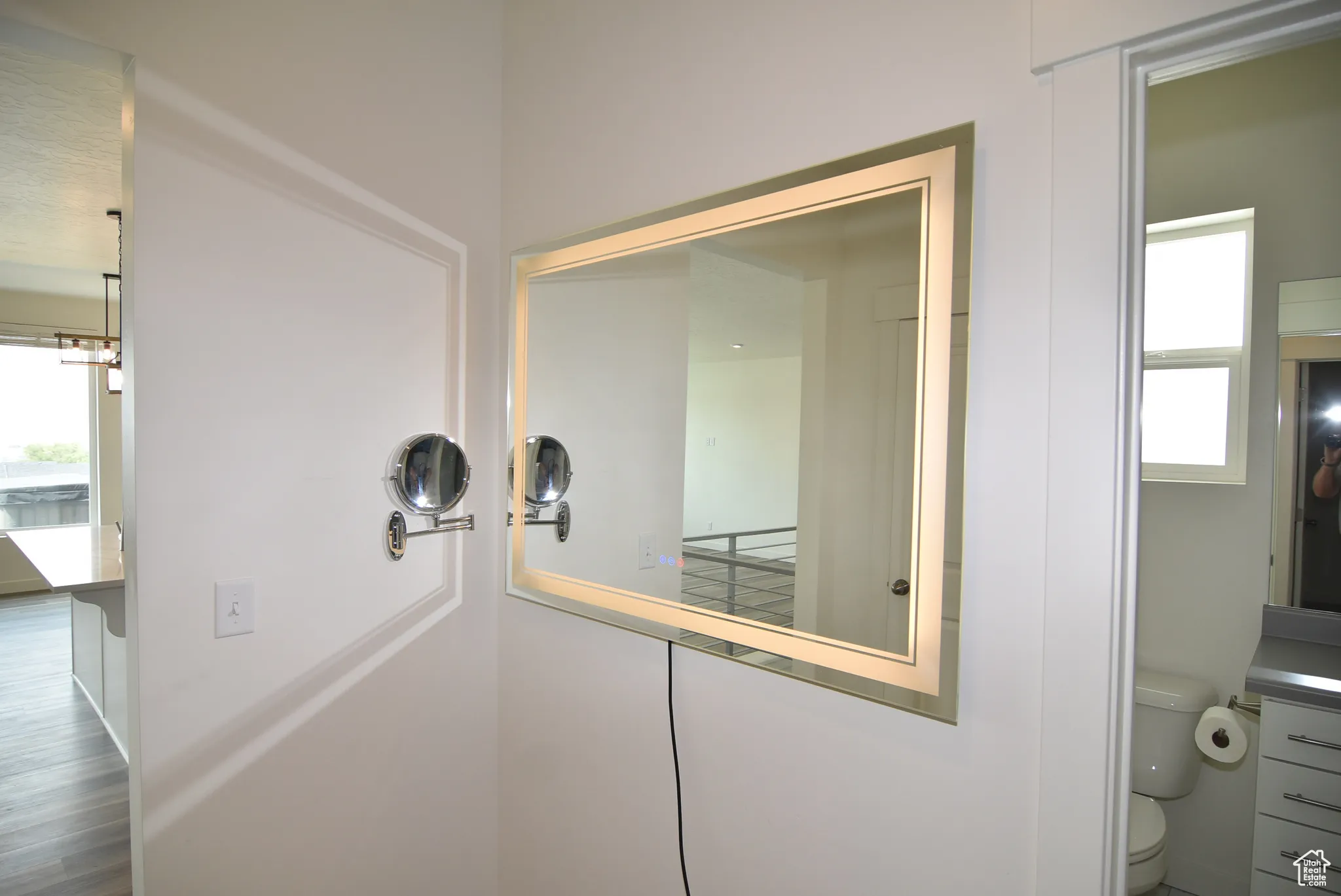 Hallway outside bathroom #2 and Bedrooms 2 & 3  with large vanity mirror.