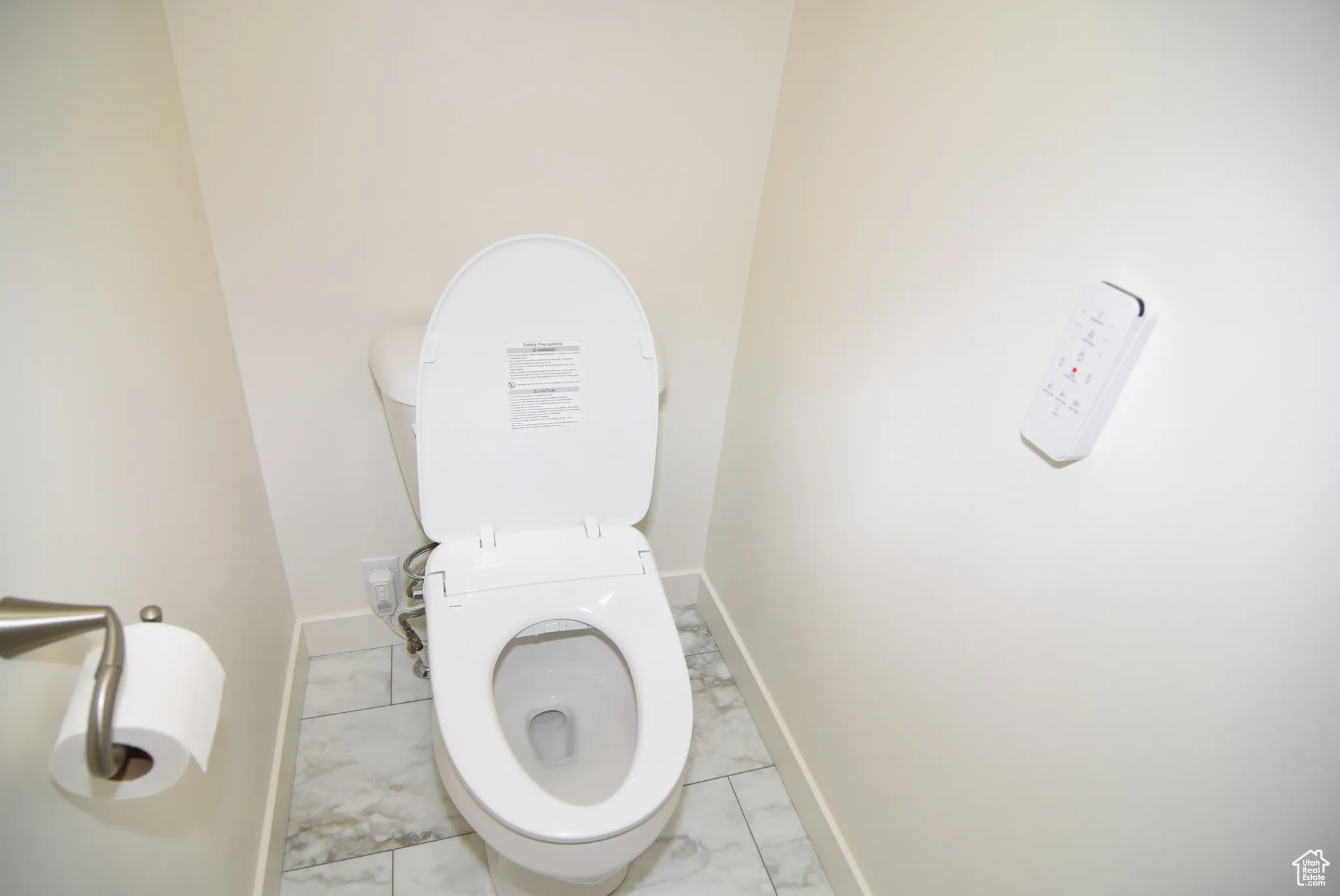 Owner's private stall toilet with heated bidet.
