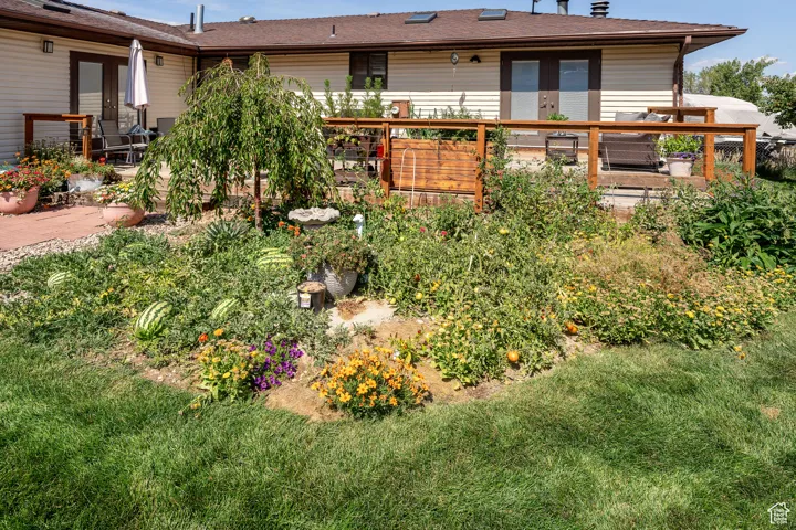View of yard featuring french doors