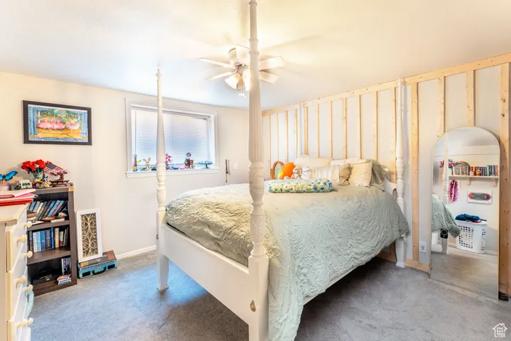 Bedroom featuring carpet floors and ceiling fan