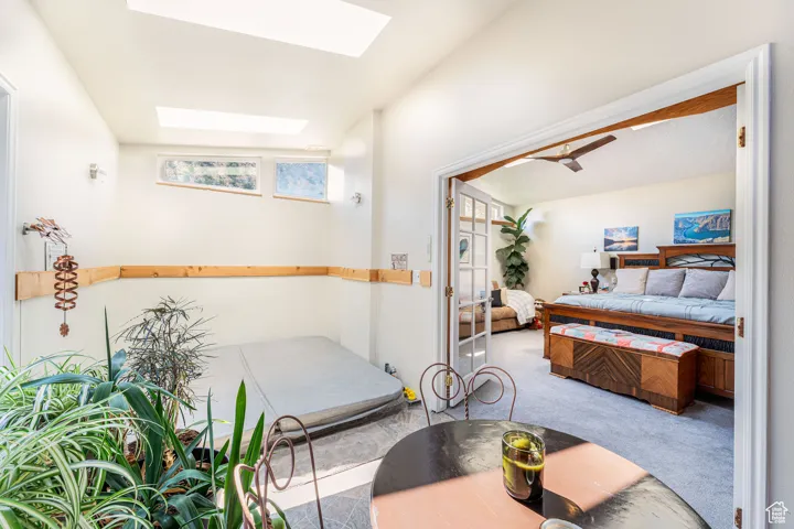 Bedroom with carpet floors and a skylight