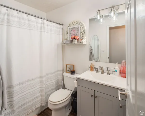 Bathroom featuring vanity and a shower with shower curtain