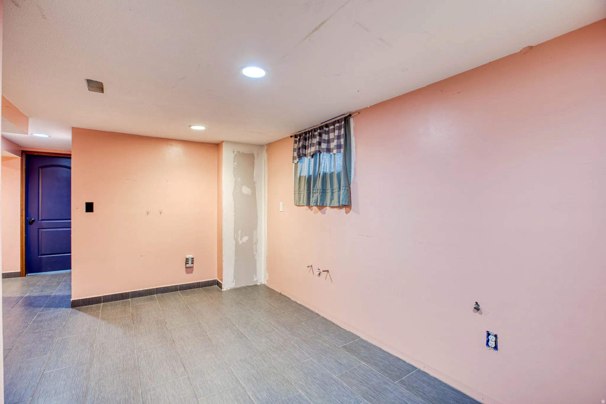 Empty room with recessed lighting and baseboards