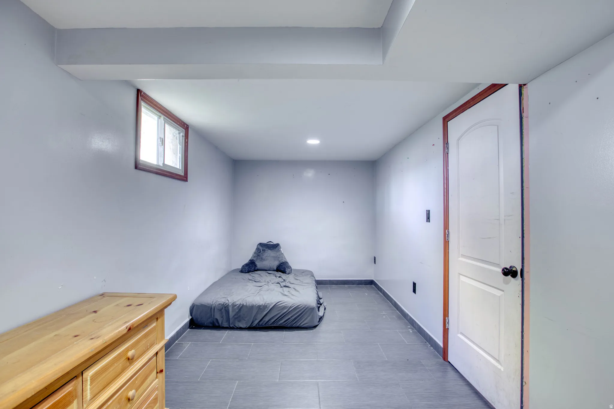 Unfurnished bedroom with baseboards