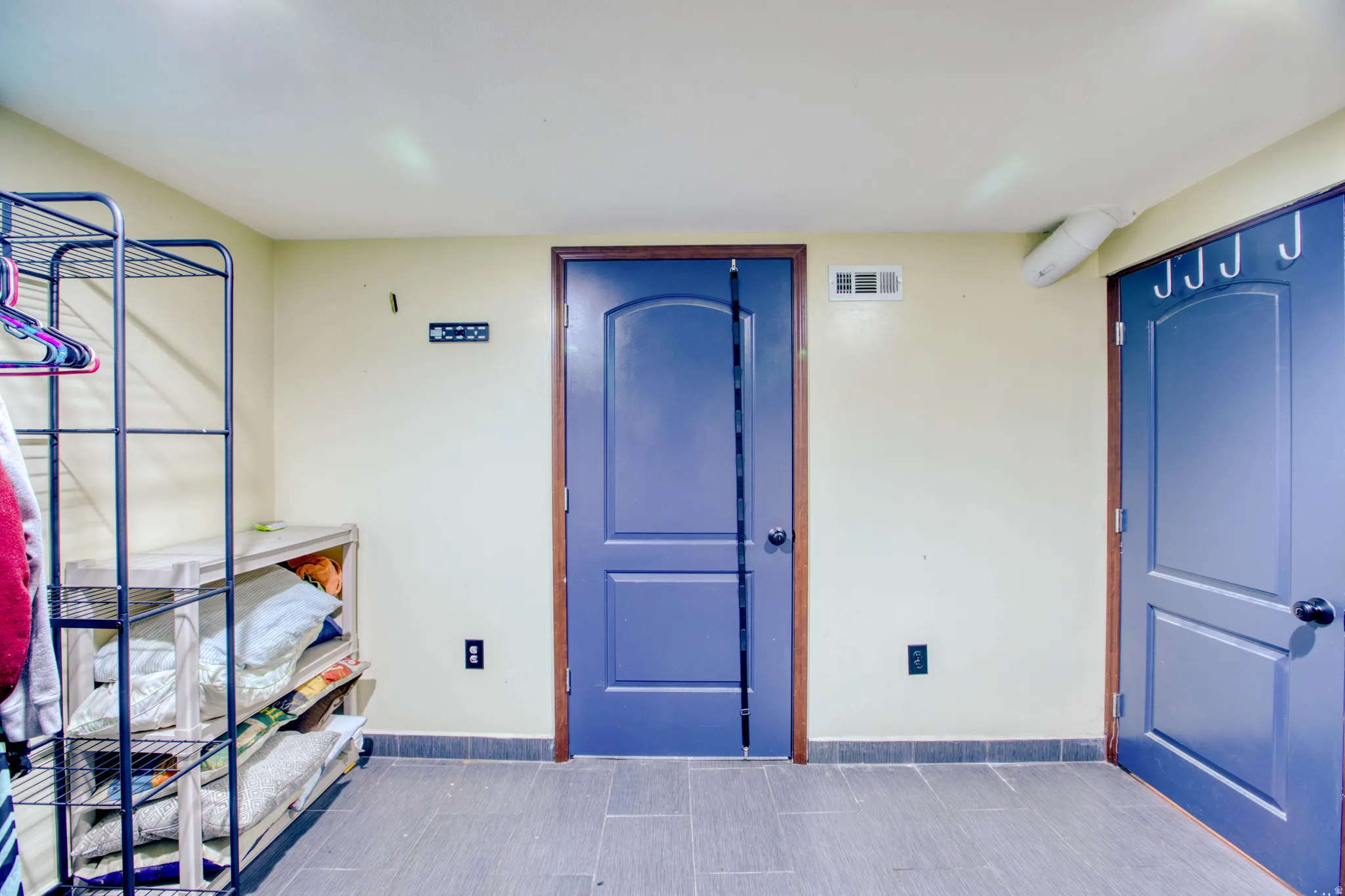 Property entrance with stucco siding