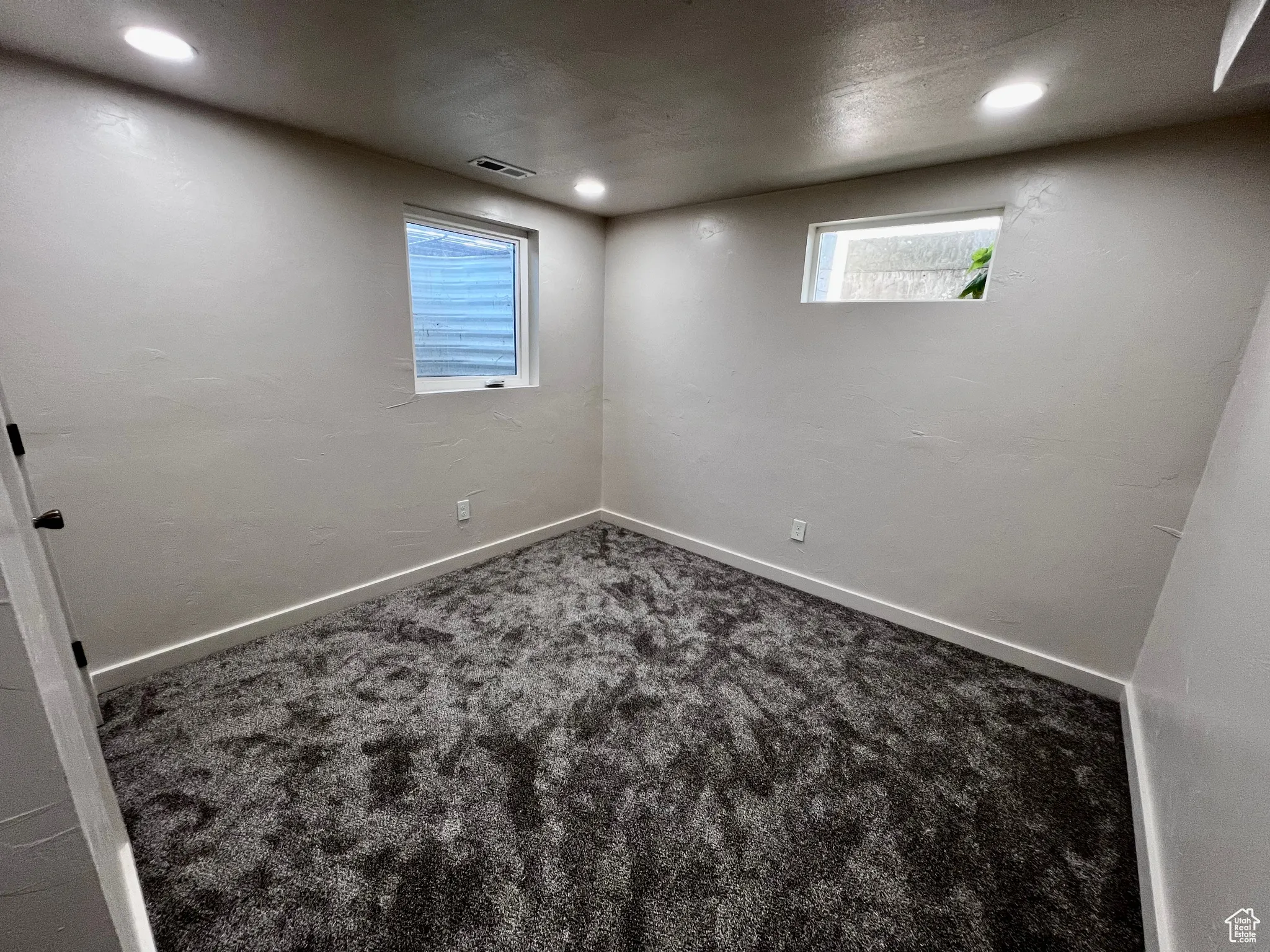 Below grade area featuring carpet and recessed lighting
