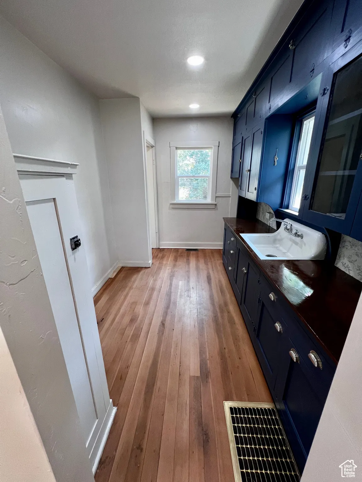 Bathroom with light wood finished floors and vanity