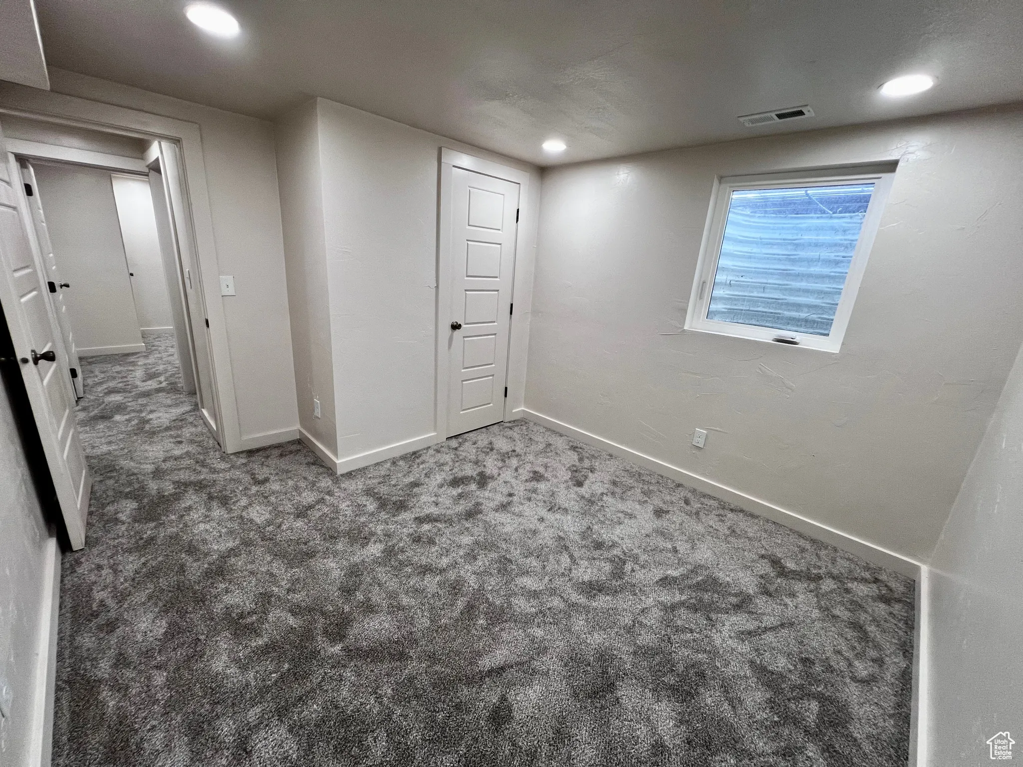 Basement with carpet flooring and recessed lighting