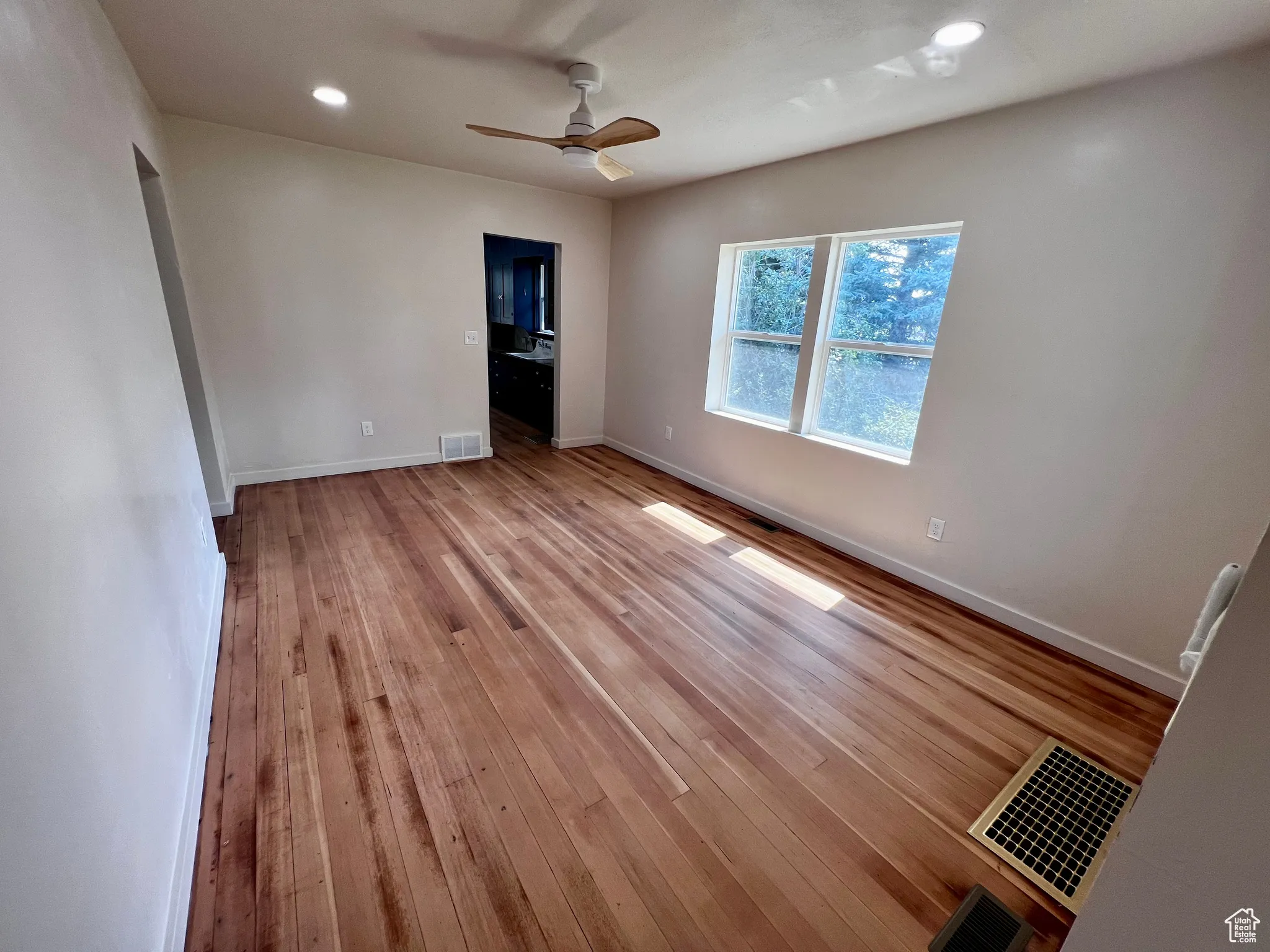 Unfurnished bedroom with light wood-style floors, recessed lighting, and ceiling fan