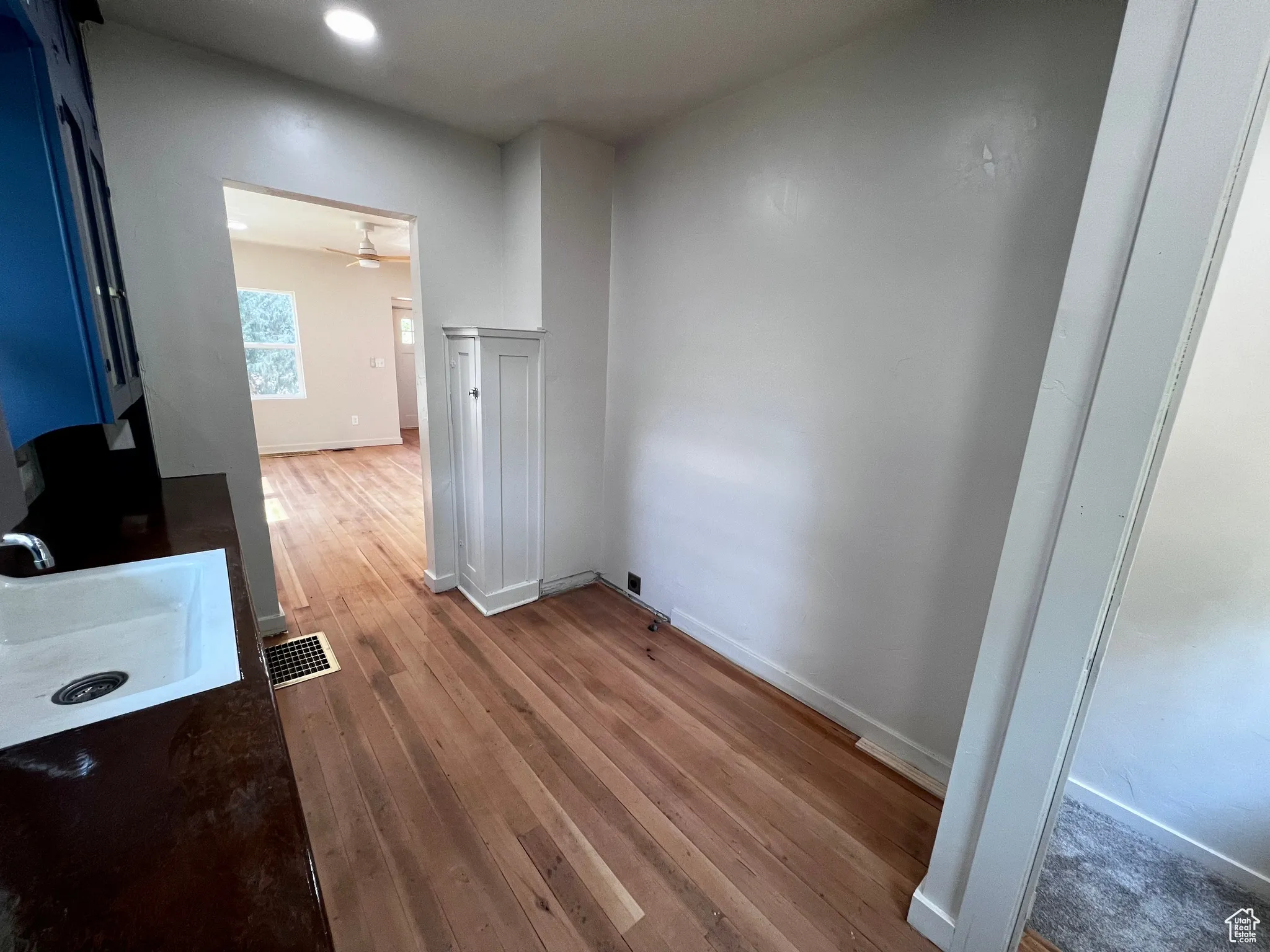 Unfurnished dining area featuring light wood finished floors and a sink