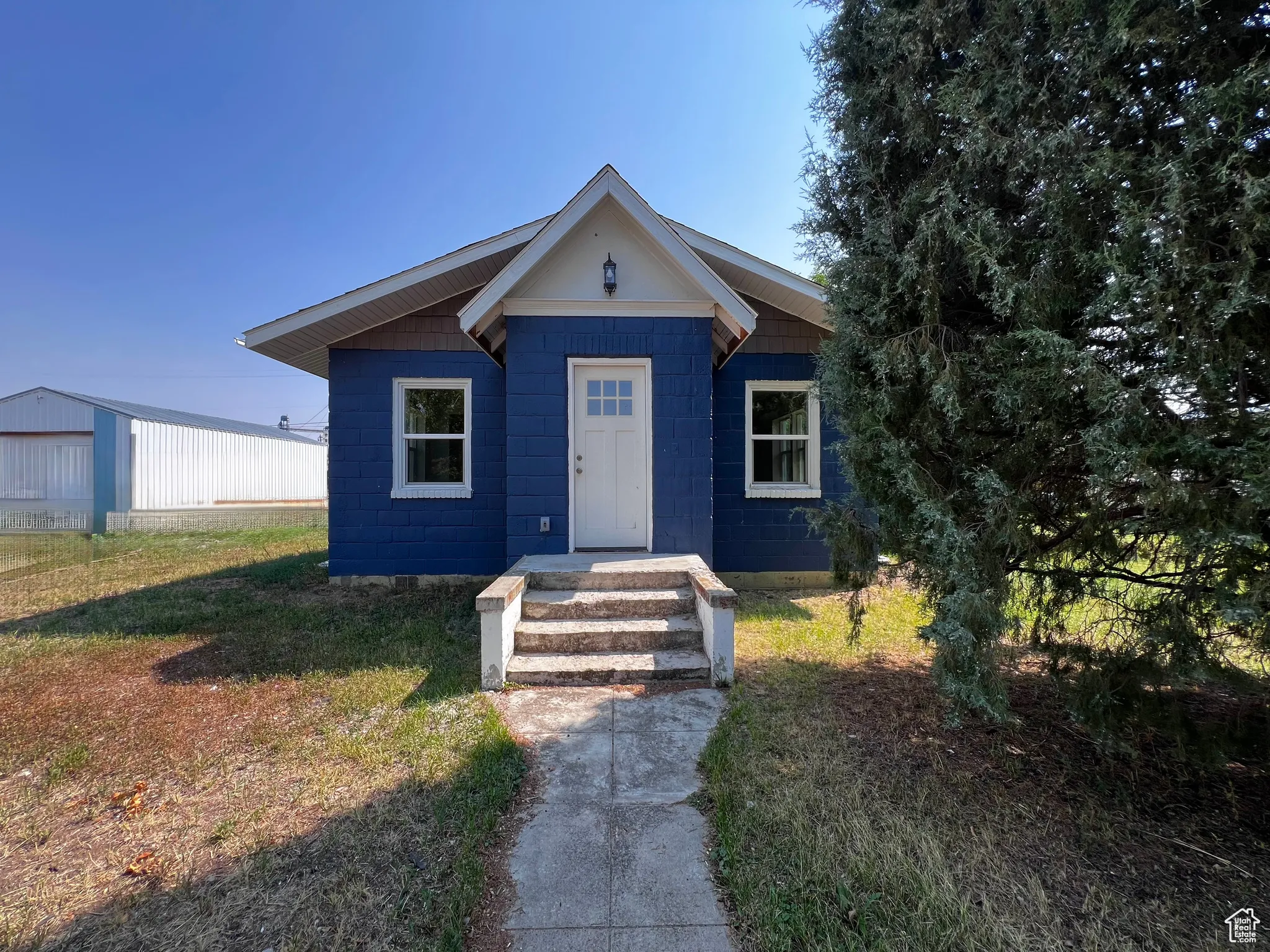 Bungalow-style home featuring a front yard