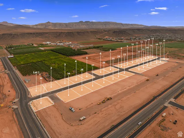 Aerial view of sparsely populated area with a mountainous background