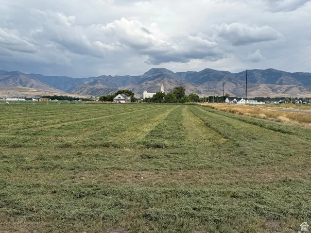 View of mountain backdrop with rural landscape