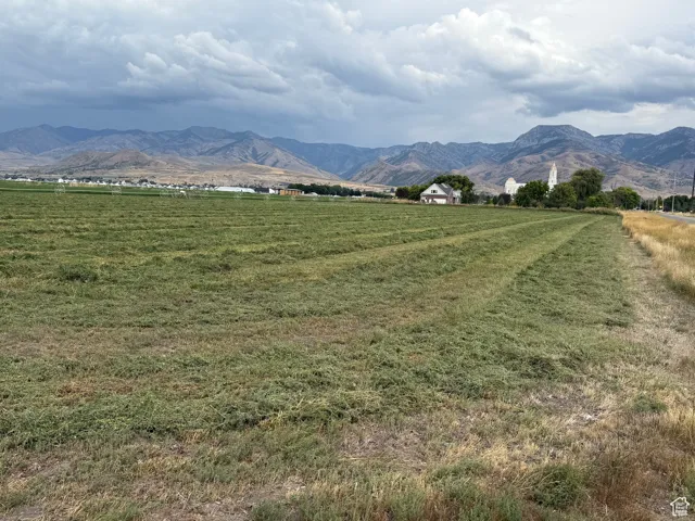 View of mountain backdrop with rural landscape