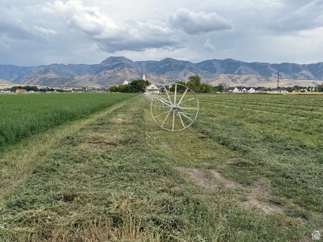 View of mountain background featuring rural landscape