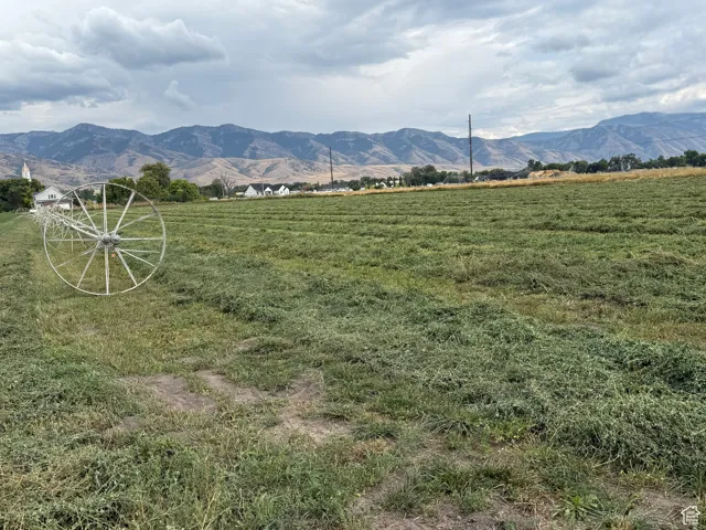 View of mountain background featuring rural landscape
