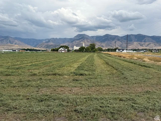 View of mountain backdrop with rural landscape