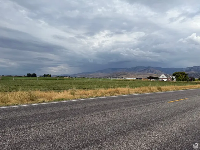 View of mountain background featuring rural landscape
