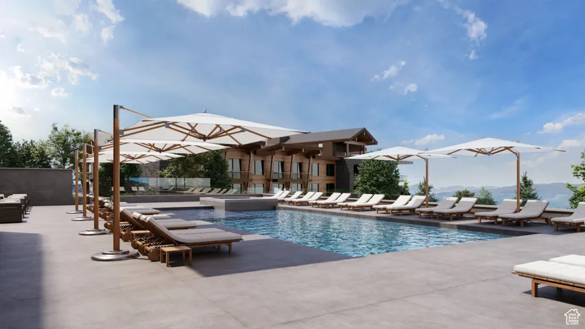 Community pool with a mountain view, an in-ground hot tub, and a patio area