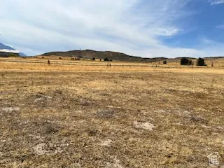 View of yard with a rural view