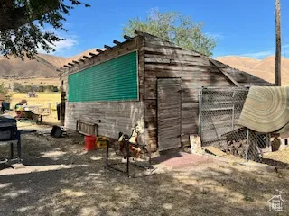 View of outbuilding featuring a mountain view