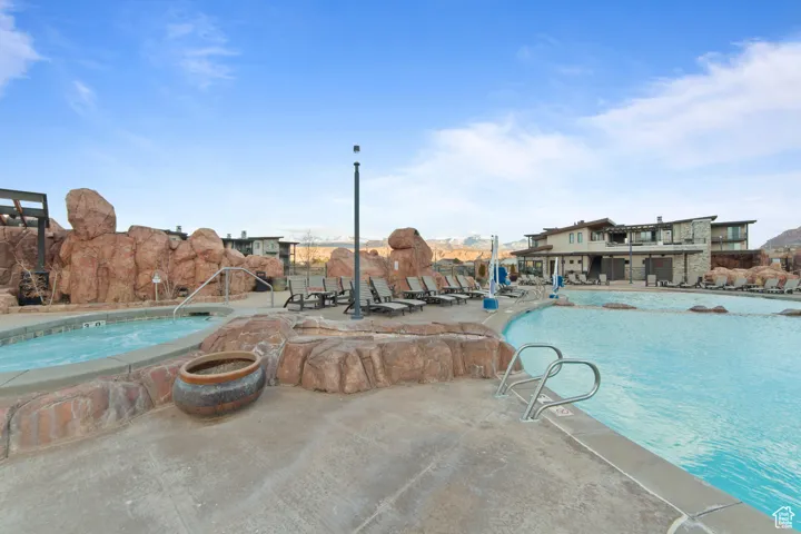 Community pool with a patio
