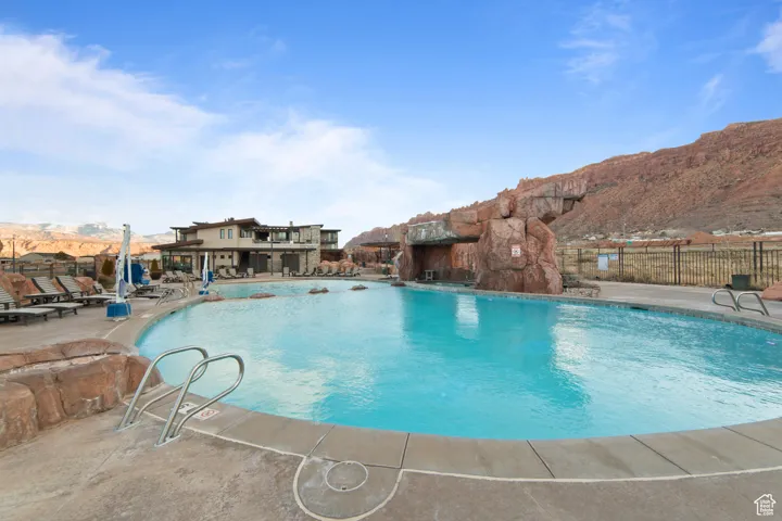 Community pool with a patio area