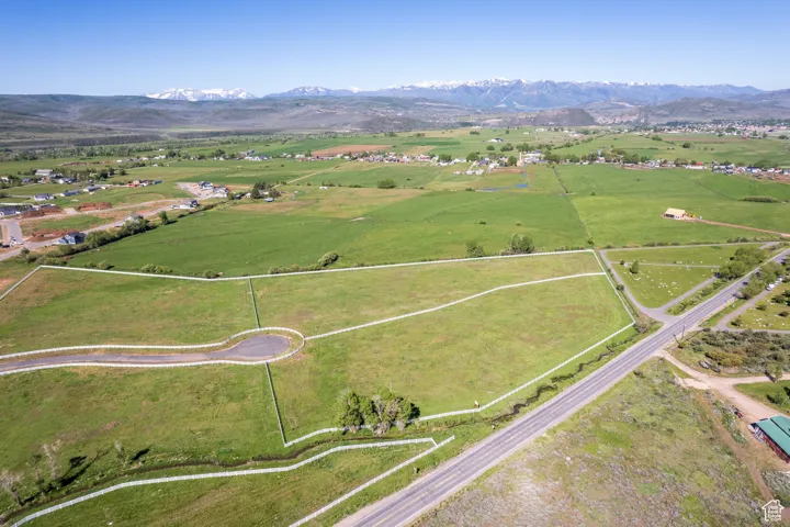 Birds eye view of property featuring a rural view and a mountain view