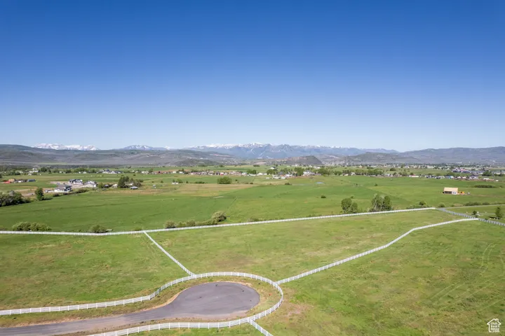 Aerial view featuring a rural view and a mountain view