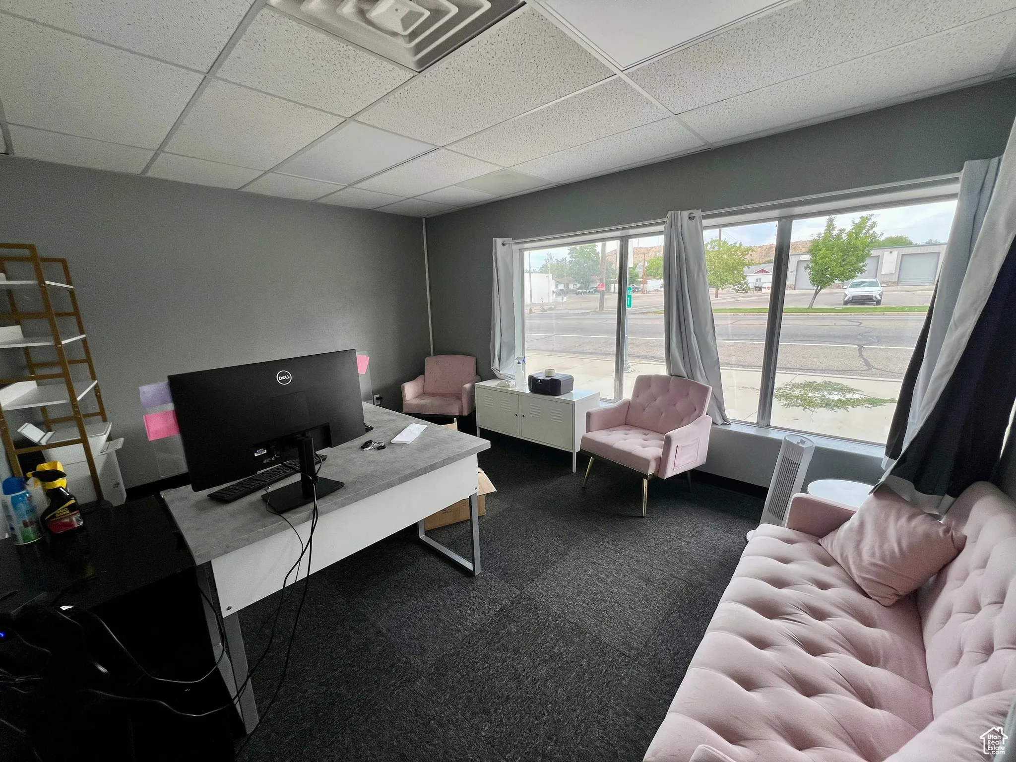 Office with a paneled ceiling