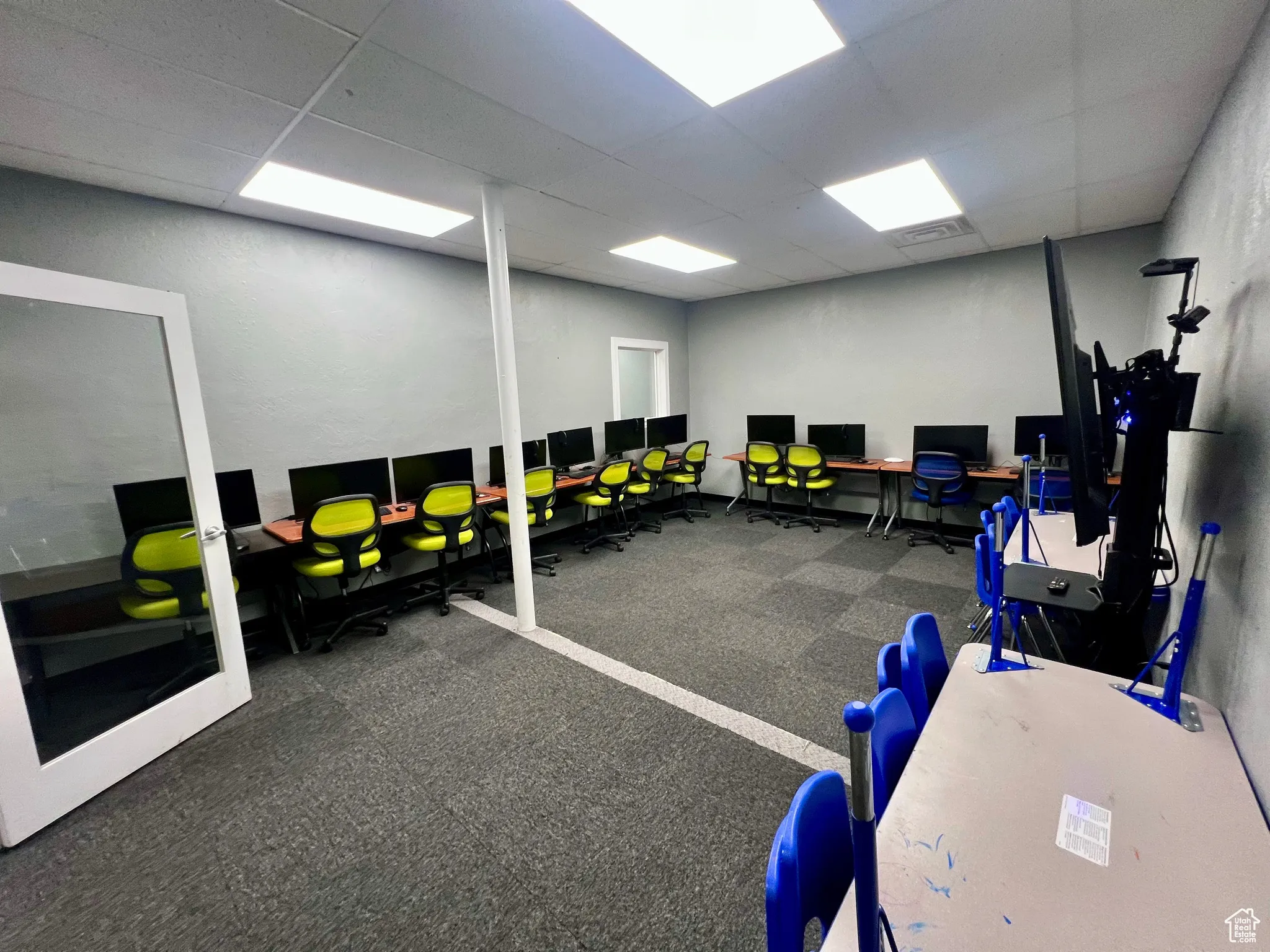 Workout room with a drop ceiling