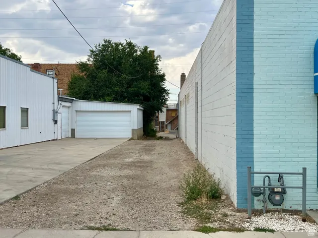 View of property exterior with a garage