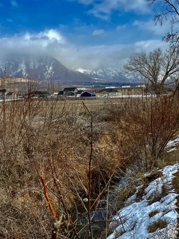 View of mountain backdrop featuring rural landscape