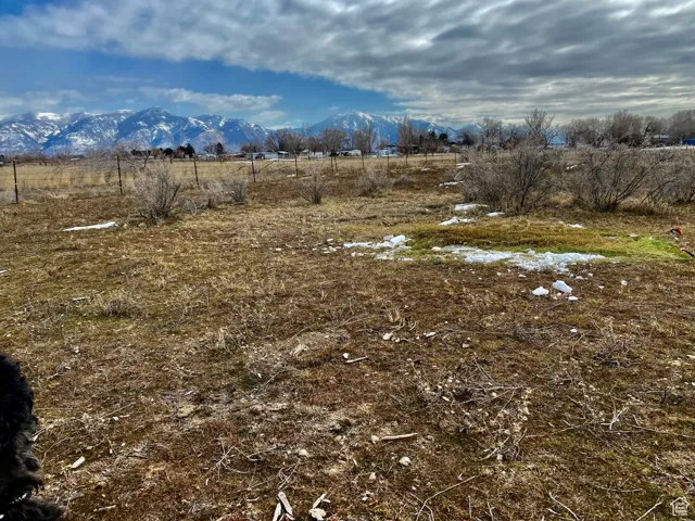 View of mountain background featuring rural landscape