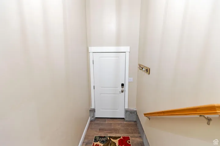 ADU: Doorway with wood tiled floors and baseboards