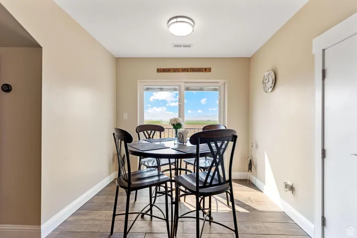 ADU: Dining space featuring baseboards and light wood-style flooring