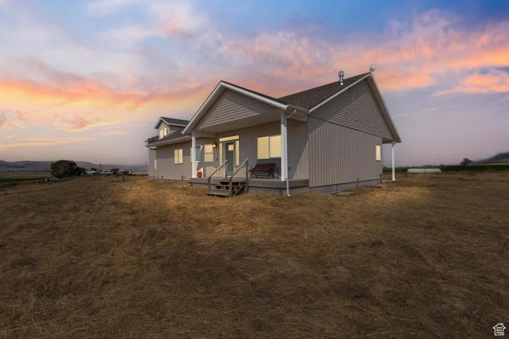 View of property exterior featuring a porch