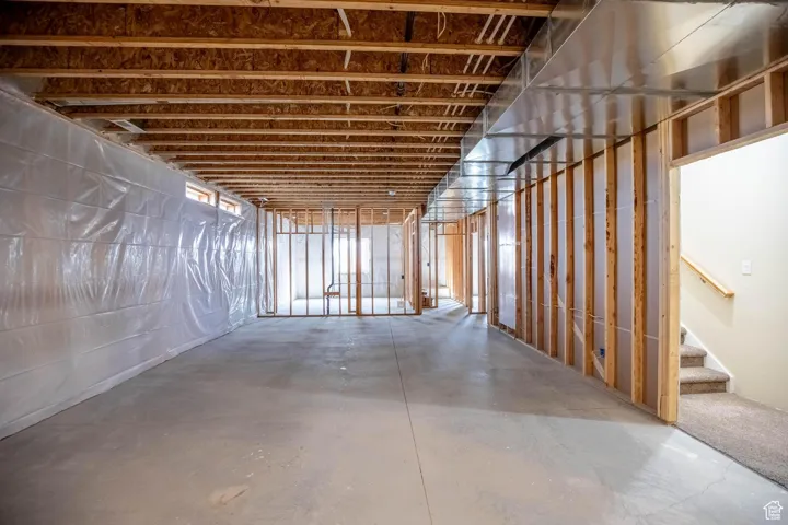 Unfinished basement with stairway