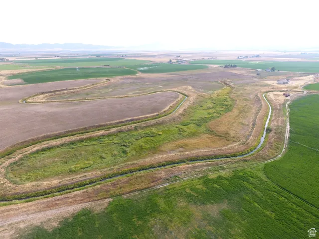 Aerial view of property and surrounding area featuring rural landscape