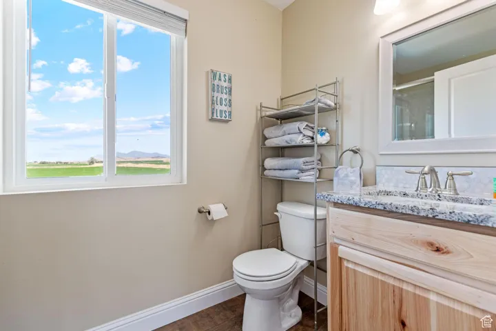 ADU: Bathroom featuring vanity and a shower with door