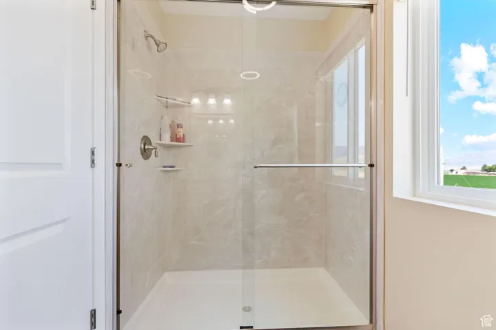 ADU: Bathroom with a marble finish shower
