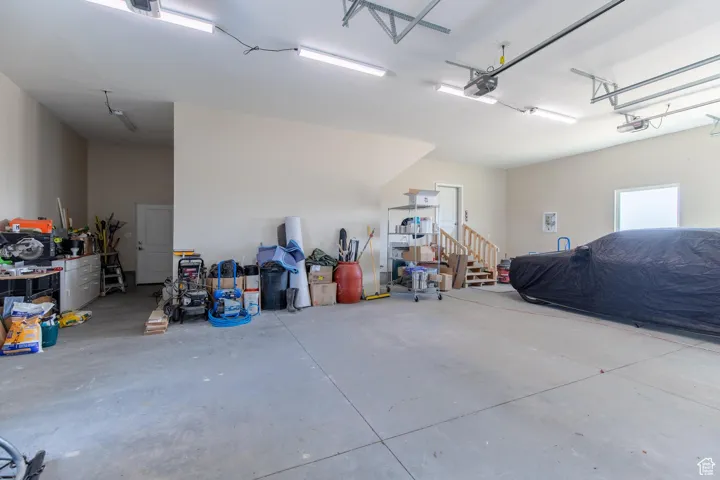 Oversize garage with 9' doors and work space.