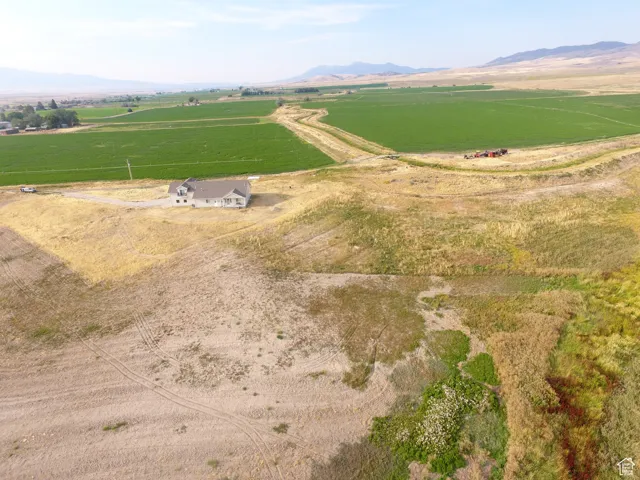 Aerial view of sparsely populated area with a mountain backdrop