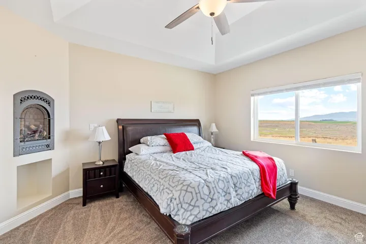 Main Bedroom with carpet, a ceiling fan, and a mountain view