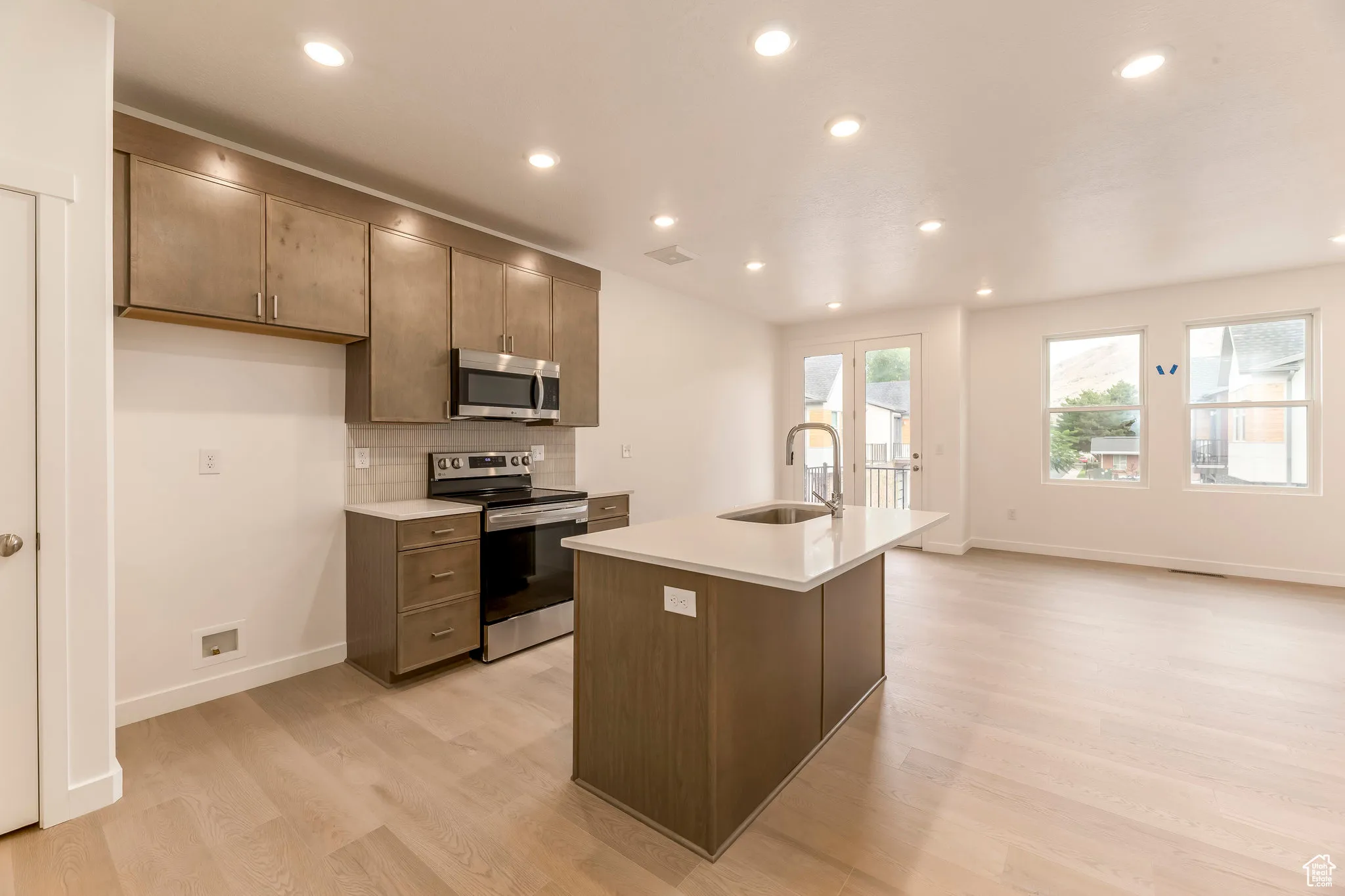 Effortlessly cook and entertain with sleek counters and open space.