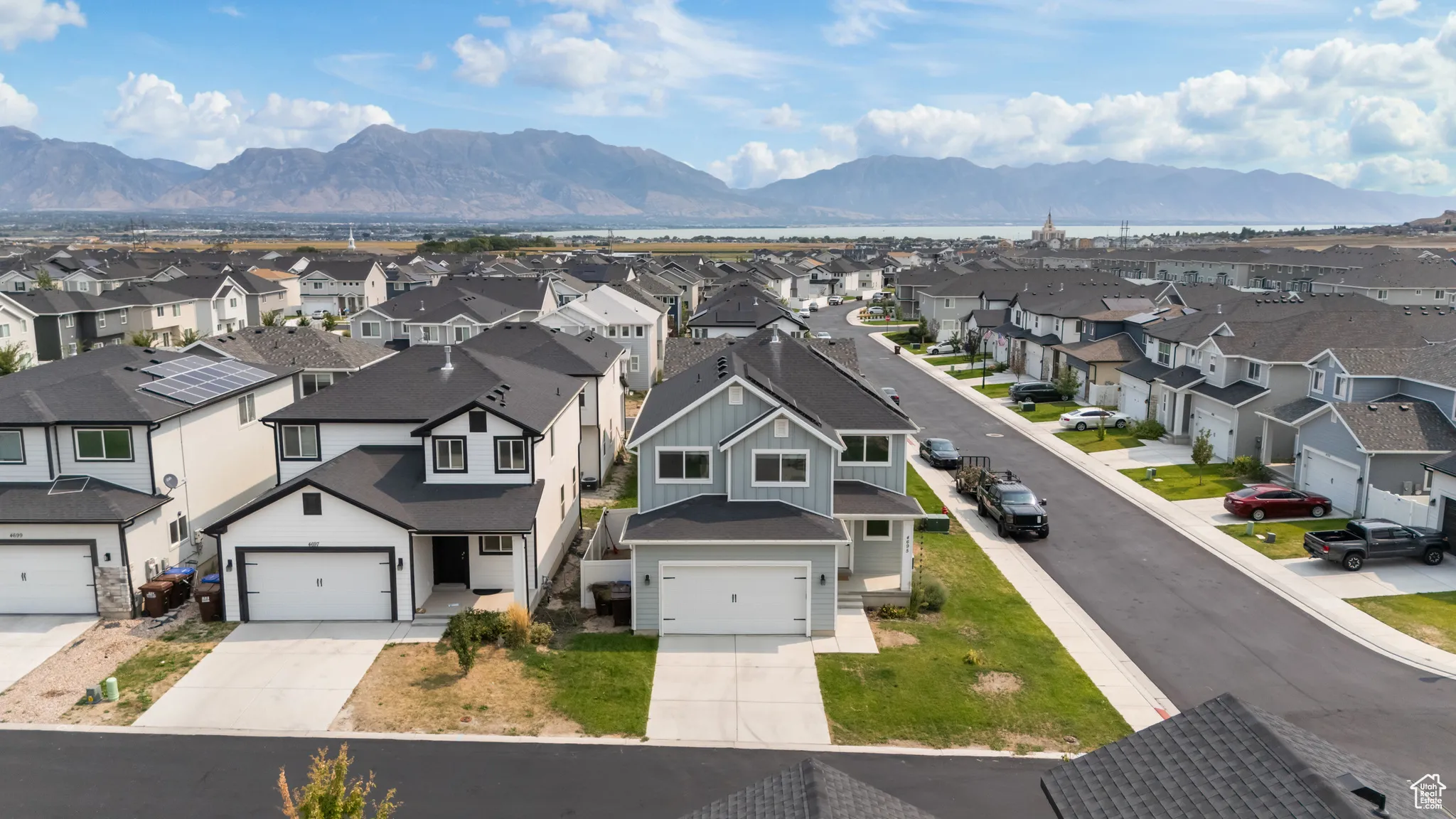 Aerial perspective of suburban area featuring a mountainous background