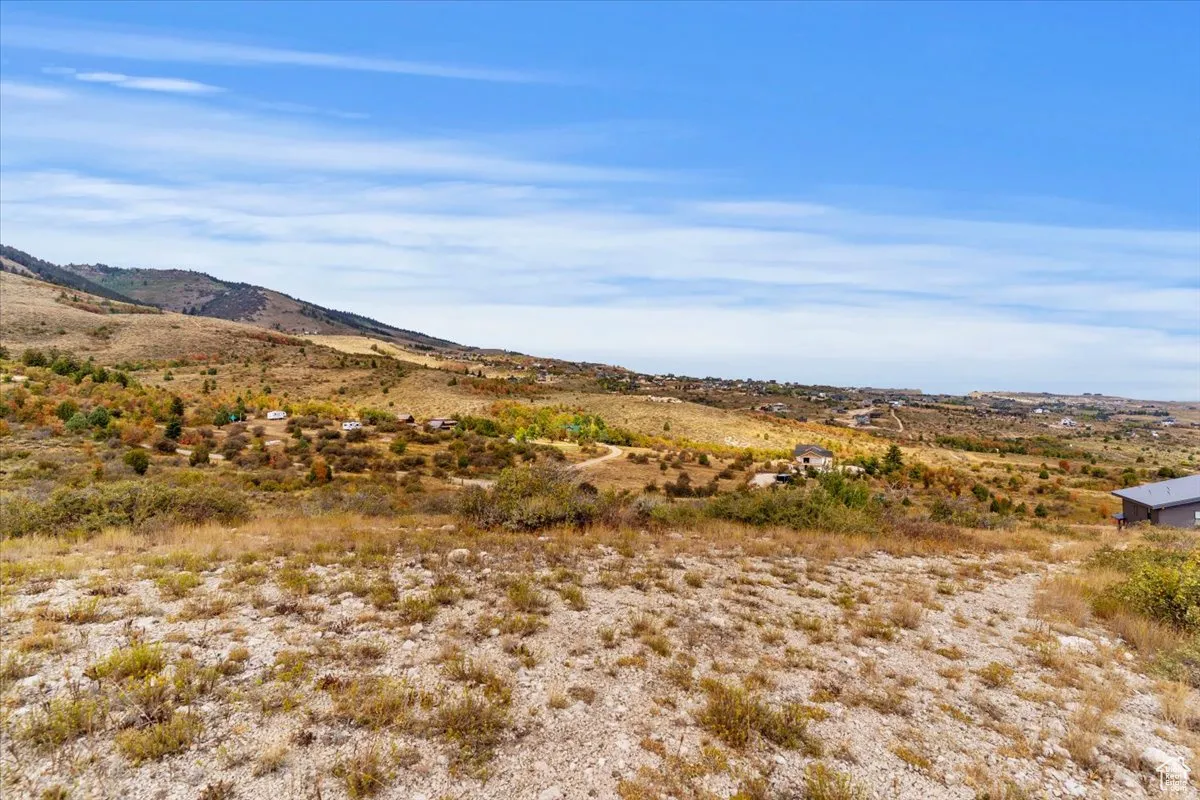 View of mountain background featuring rural landscape