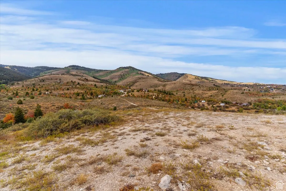 View of mountain background featuring rural landscape
