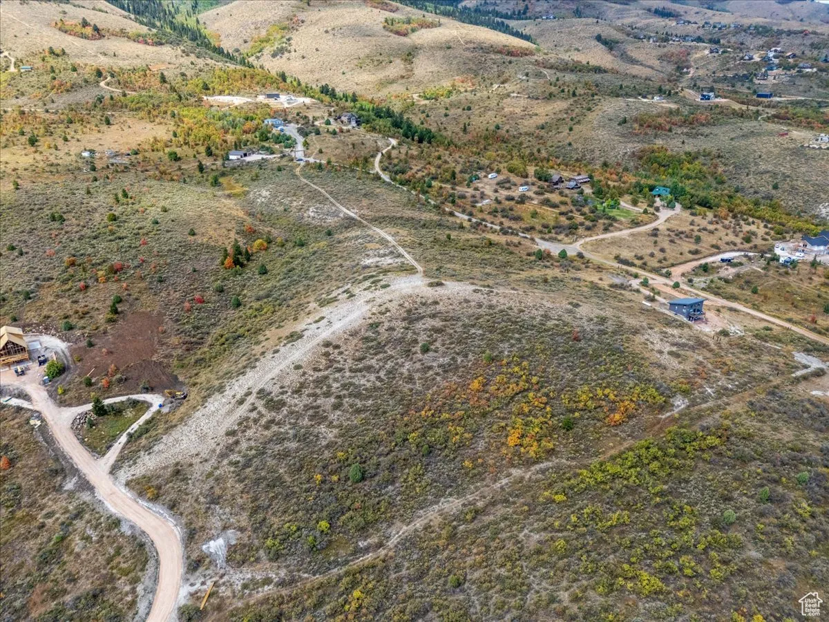 Aerial view of property and surrounding area featuring rural landscape