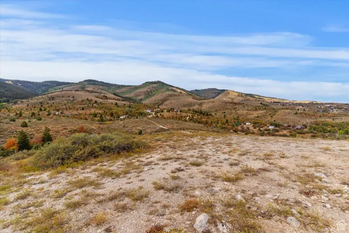 View of mountain background featuring rural landscape